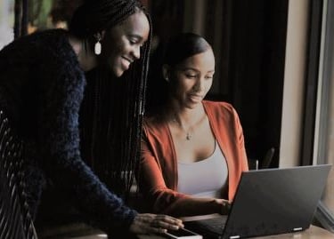 Young professional smiling with improved credit score