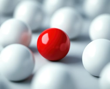 a red ball in a group of white balls
