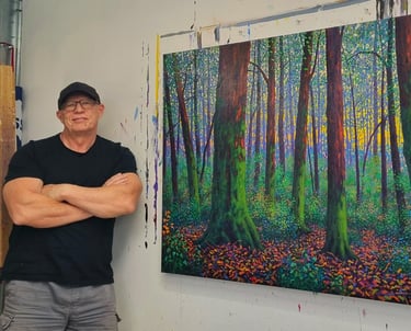 Kevin McKeown chromatic impressionist artist in the studio with a completed oil painting