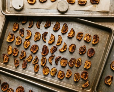 A worker's dirty hands holding a raw organic cocoa pod over rustic soil and tree bark.