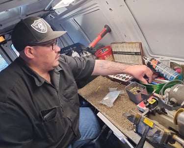 a man in a black shirt and a hat on a table