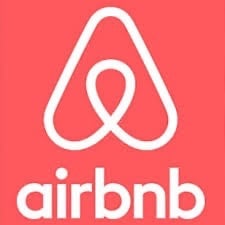a red airbnb logo with the airbnb logo