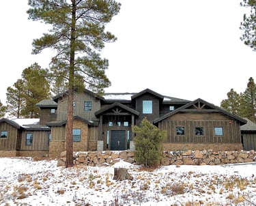 custom home in the mountains with rock wall 