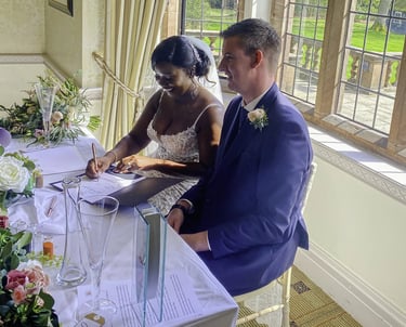 Couple Signing Their Certificate At Their Wedding Ceremony