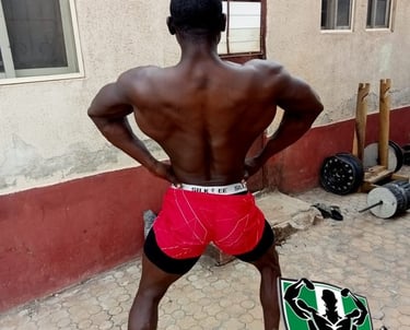 Plateau bodybuilder back lat spread pose
