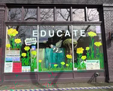 Exterior photo of Magpie Thrift window with flowers painted on it