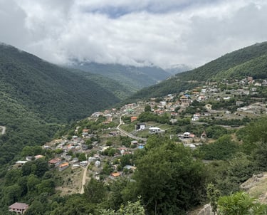 Mountain village of Kalej in Mazandaran, Iran, green valley with houses.