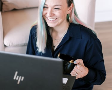 Tabitha with butterfly effect consulting talking to a client on her laptop