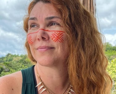 a woman with red and white painted face paint