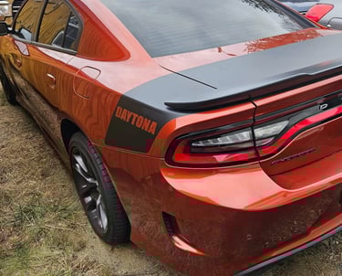 Orange Dodge Charger representing sports car auto Lovksmith local to Canton, NC