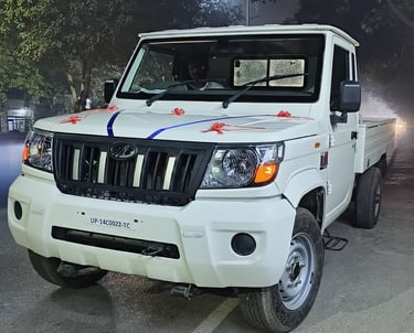a white truck with a blue and white stripe on it