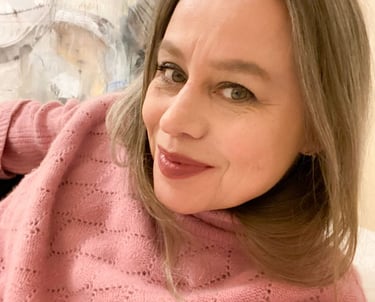 Close-up on Stefanie wearing a pink jumper.