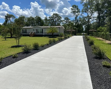a driveway with a driveway and a house