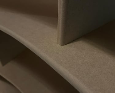 Close-up of unfinished MDF furniture boards featuring smooth bullnose edges and matte wood fiber texture.