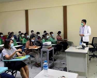 Dr Zaw giving a health talk in a room
