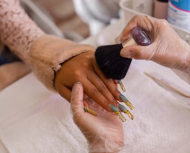 a person is getting their nails done by a manicure