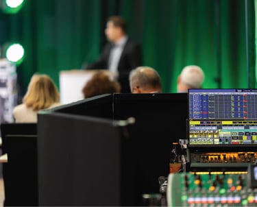 Conference audio mixing console in use during a live corporate presentation in Dubai, managed by Sonus