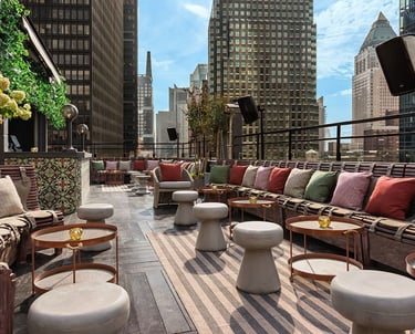 Glamorous rooftop setting at PHD Terrace with plush seating and city views, Midtown Manhattan.