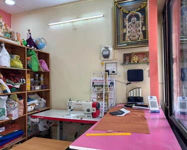 a sewing machine in a room with a pink counter top