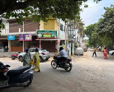 a man riding a motorcycle down a street