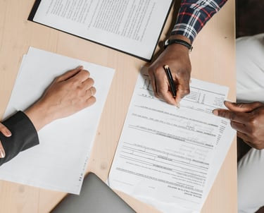 People Doing Paperwork at a Desk