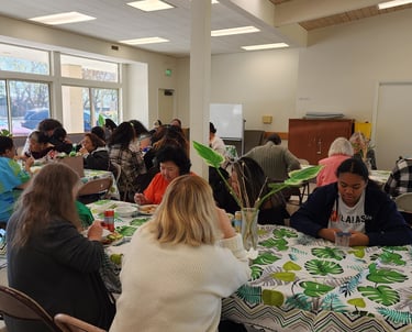 people gathered around table sharing a meal.