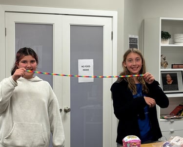 girls doing fun math activity.