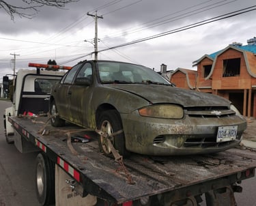 A junk car being towed away from a clients residence in Surrey