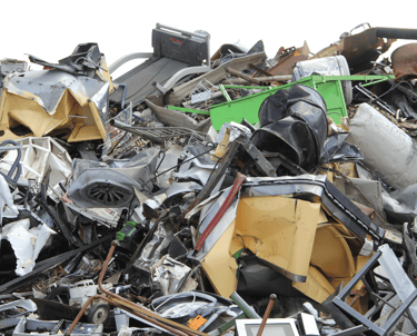 a pile of old metal equipment and scrap steel