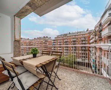 Private balcony with outdoor seating overlooking Plaza del Sauce, San Sebastian