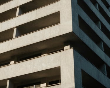 An architectural detail shot of a Durban building featuring clean lines and natural shadows. Authentic, South African urban photography.