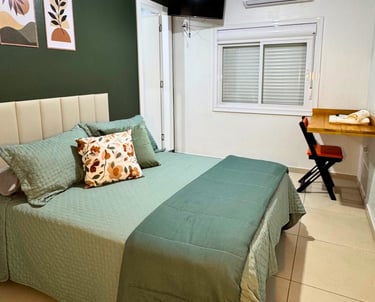 Cama do apartamento executivo do Hotel Presidente em Ibirubá RS
