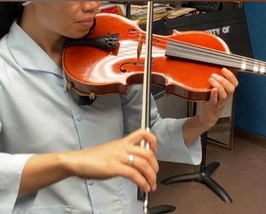 Violin lessons student practicing with violin and bow