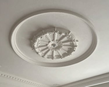 Close-up of a beautifully finished fall ceiling showcasing smooth plaster of Paris details.