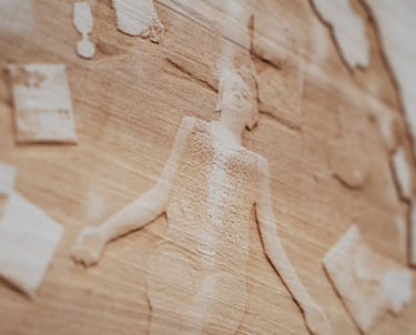 A laser engraved portrait of a woman with MS sharing a story about fatigue
