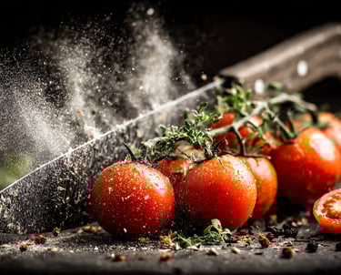 tomatoes are being sprinkled with spices and spices