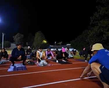 a group of people barefoot training on a track with Ray Z Unstoppable