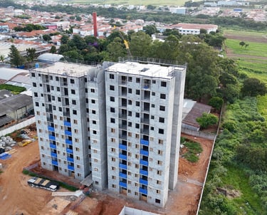 a tall building with a crane in the middle of it