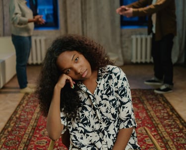 a woman sitting on a chair in a room