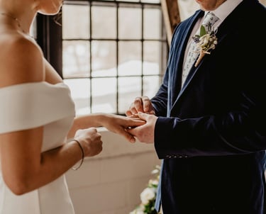 a man and woman getting married in a wedding ceremony