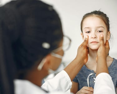 a girl with a doctor's eye patch on her face