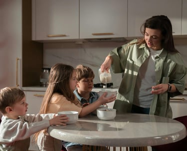 a woman is pouring milk into a bowl of milk