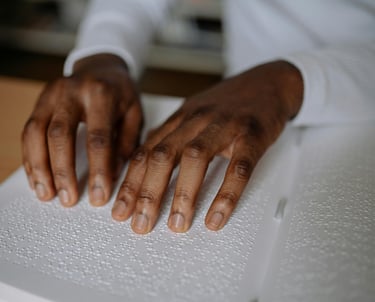 a person's hands on a book