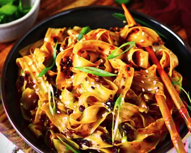 a bowl of noodles with Longka Kando Chili Crisp Oil