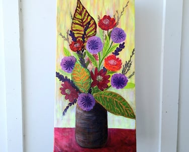 Vibrant floral painting of red and purple flowers in a dark vase on a yellow background.