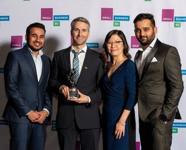 a group of people standing around a man in a suit, TWC Financial clients