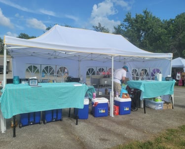a pop-up with a table with a table cloth
