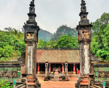 The historic Dinh Tien Hoang Temple in Hoa Lu Ninh Binh, featuring ancient stone pillars and a traditional Vietnamese