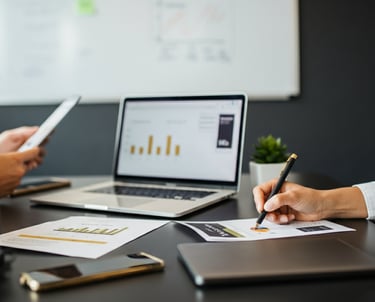 Verve Phoenix team analyzing SEO strategies with keyword research reports and ranking charts in a gold and black-themed works