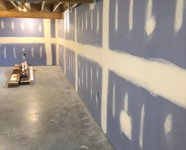 new blue drywall on basement walls